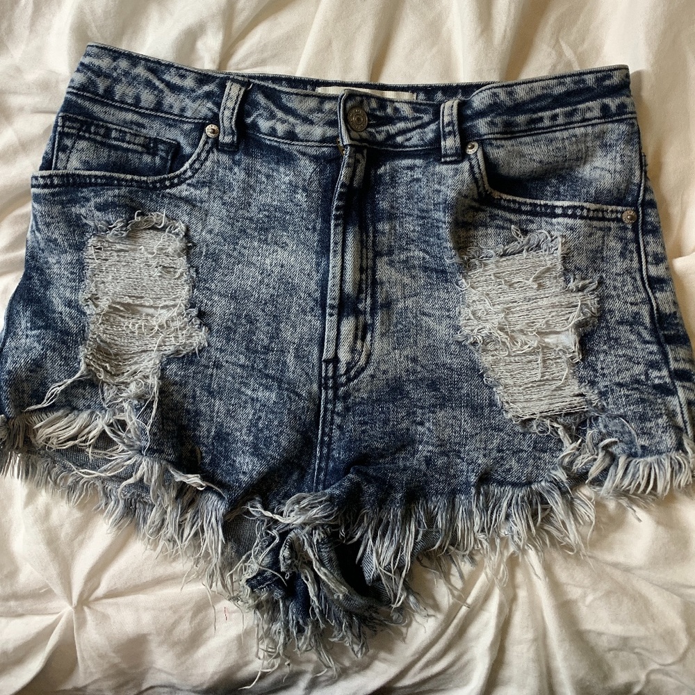 Distressed dolphin cut shorts